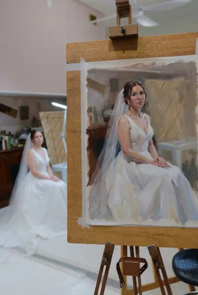 Oil portrait of a seated bride in a V-neck gown and veil, painted from life on an easel, by Anne Smerdon