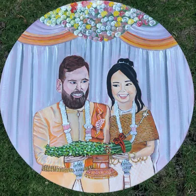 Acrylic painting on a round canvas of a couple in traditional wedding attire with flower garlands, by Jacintapaints