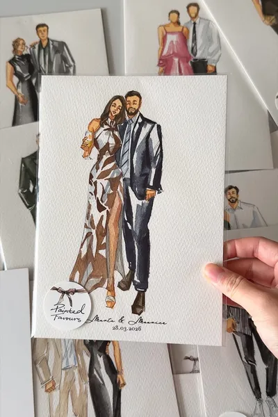 Watercolour fashion illustration of a guest couple in a printed gown and navy suit, by Painted Favours