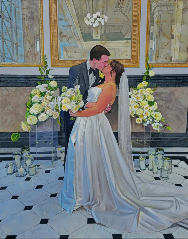 Large live acrylic wedding painting of a couple kissing between white floral arrangements and candles by Sarah Di Martino