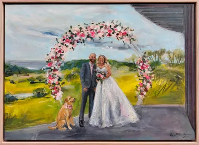 Framed live wedding painting of a couple and their dog under a pink floral arch by Wedding Day Painter