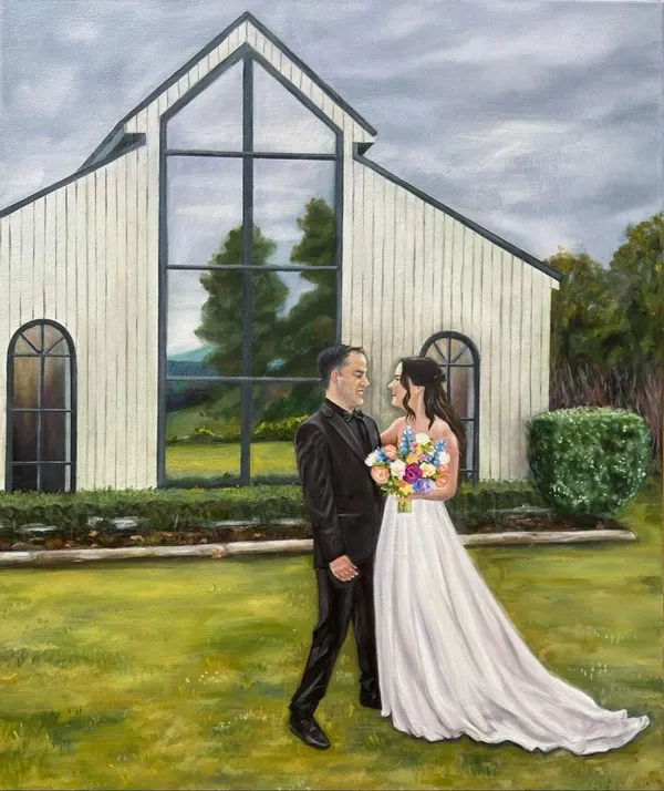 Live acrylic and oil wedding painting of a couple outside a white barn-style chapel by Lucy Allnutt of Your Wish I Paint